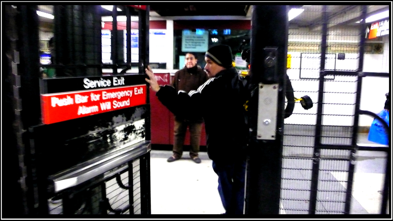 MAN CARRYING BIKE WITH TRAINING WHEELS ILLEGALLY HOLDS SUBWAY DOOR OPEN FOR ME