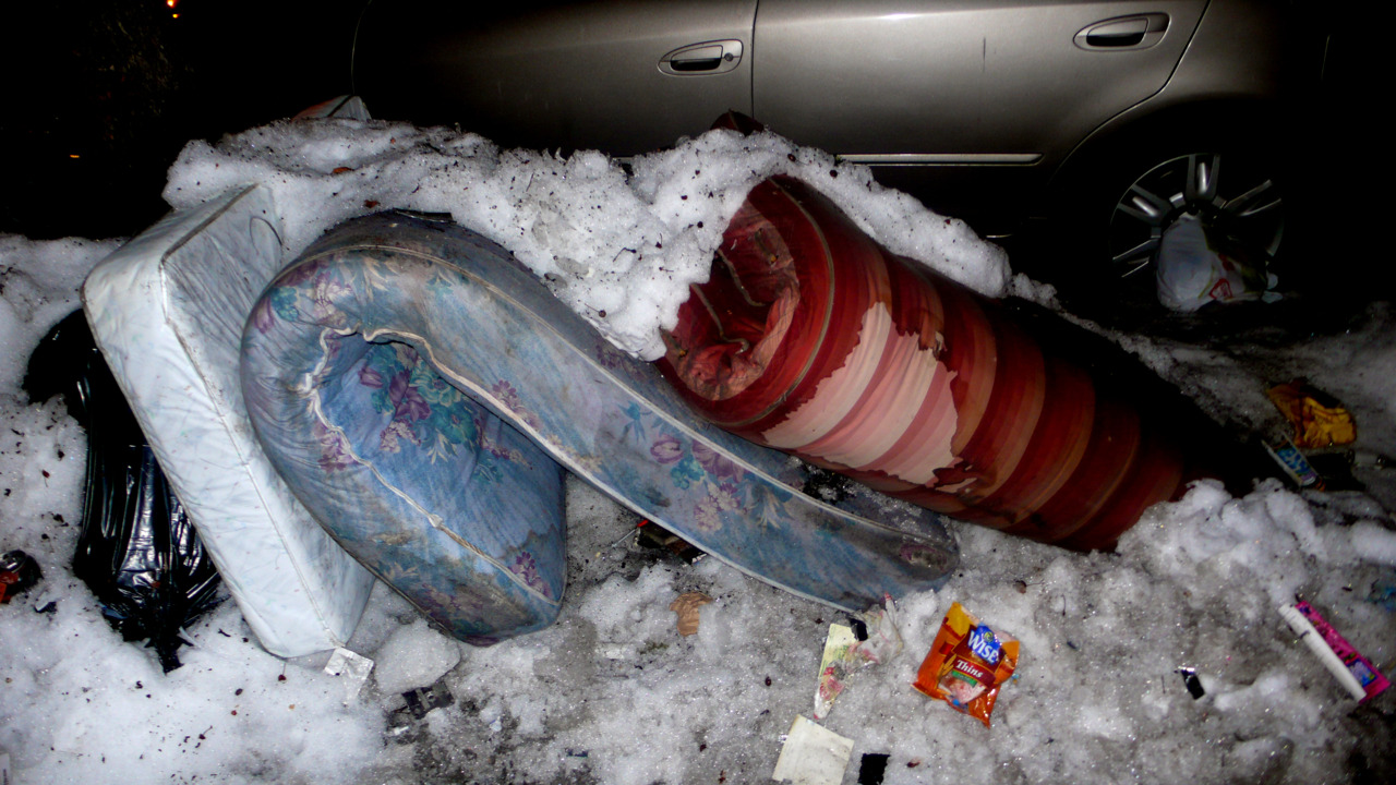 Mattress being revealed by the melting of the snow drifts.